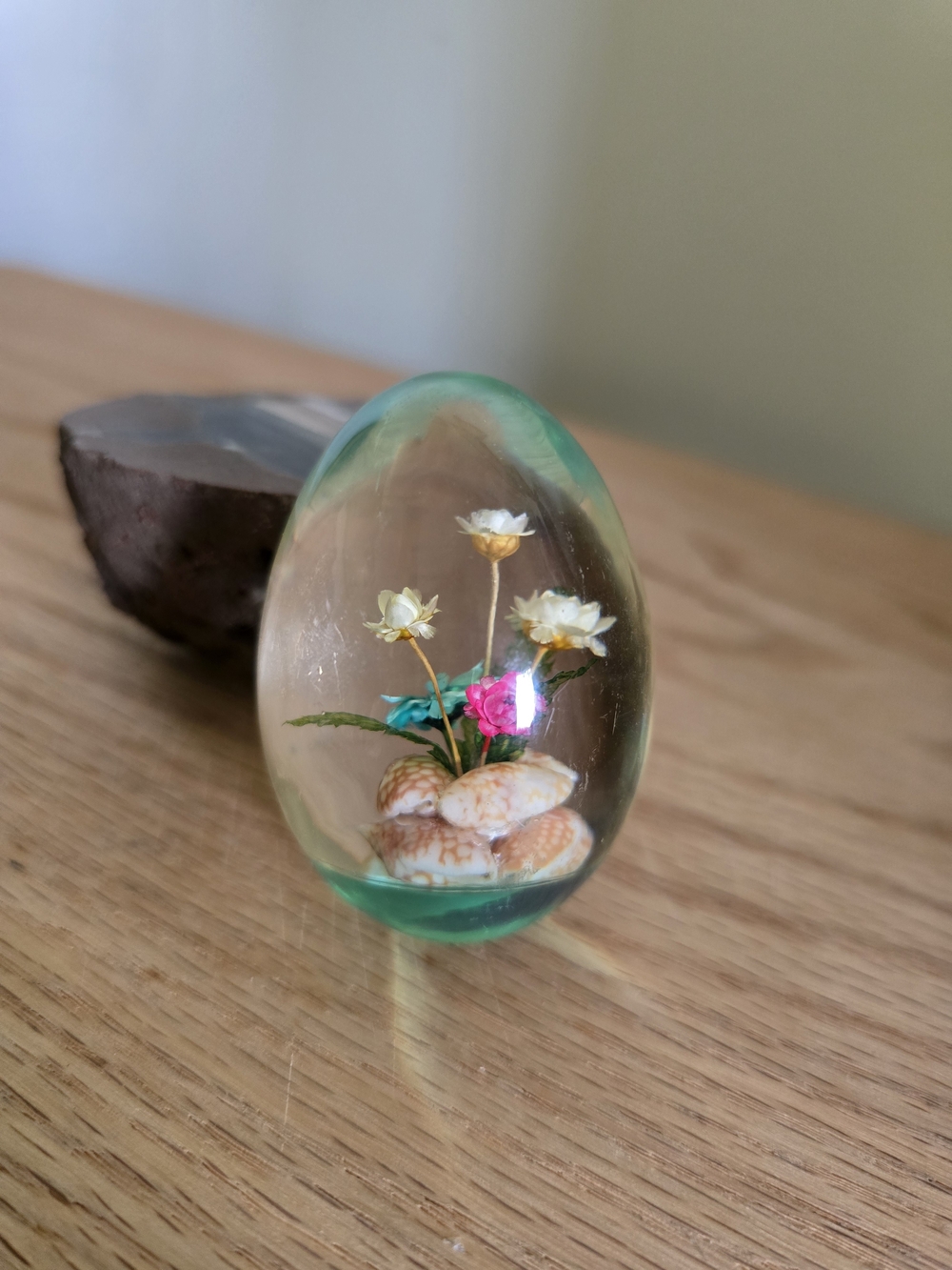 vintage retro decorative egg made of lucite acrylic with encased flowers and sea